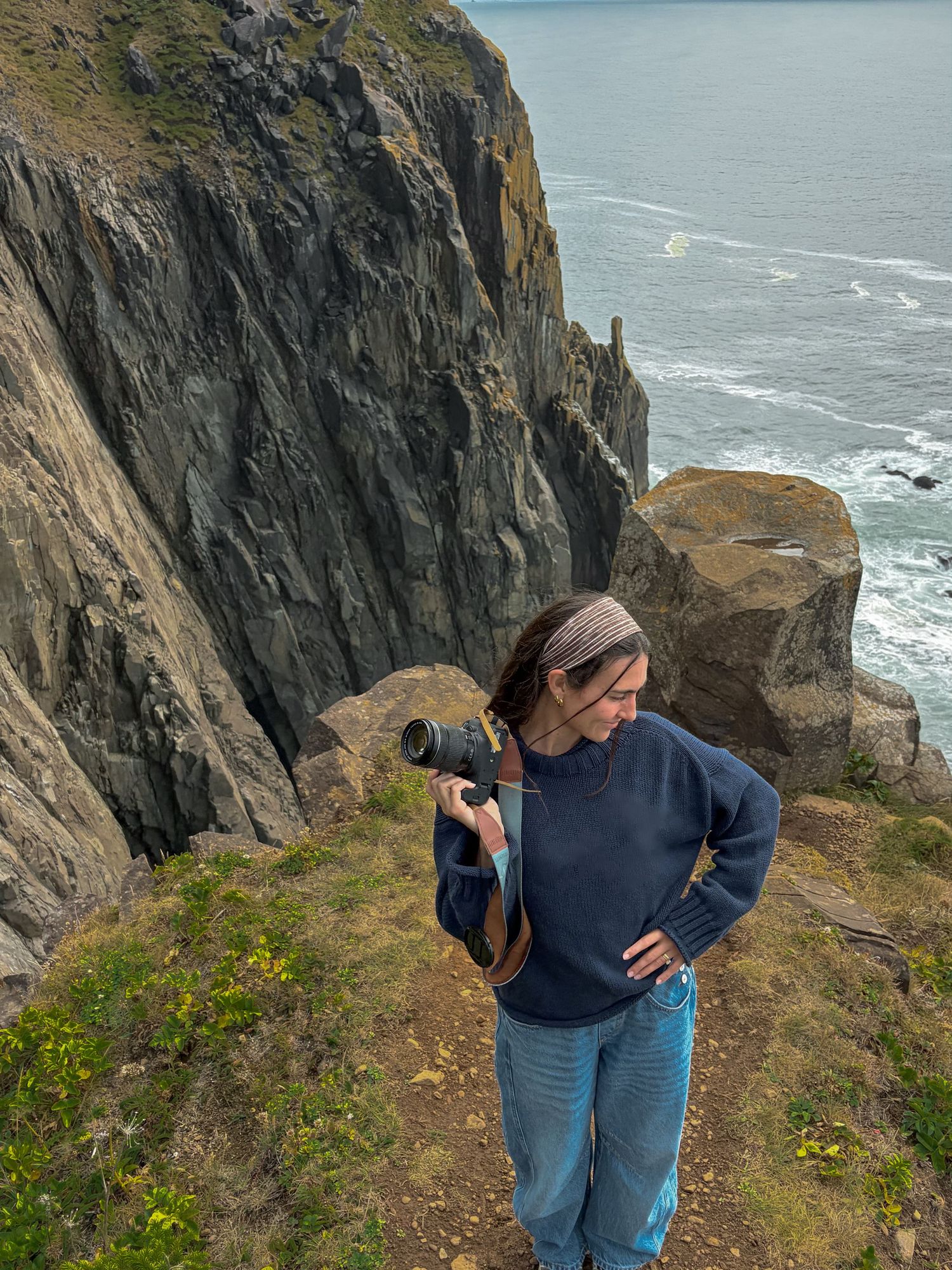 Eden exploring a coastal cliff