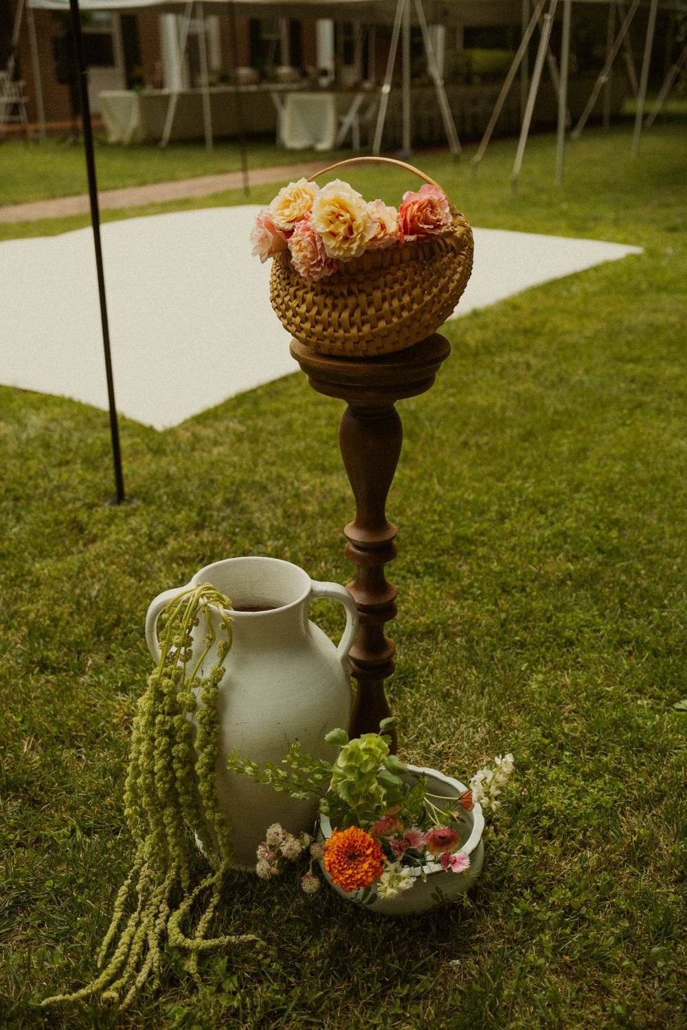 Garden-style floral arrangements displayed outdoors in warm light