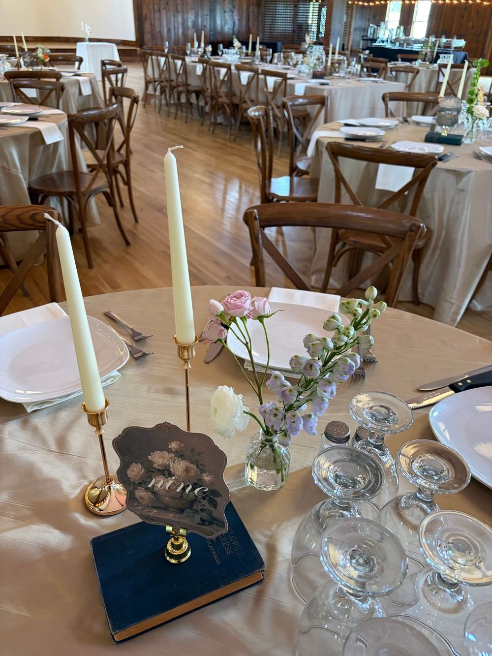 Small floral arrangements on a reception table